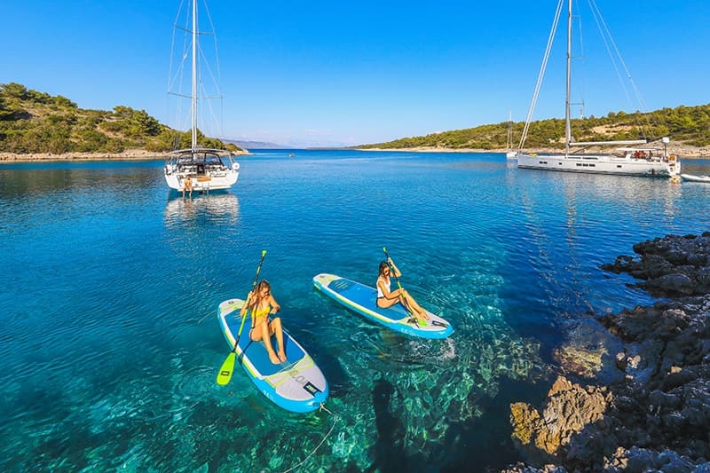 Bareboat charter — sailing yacht anchored in a Croatian bay