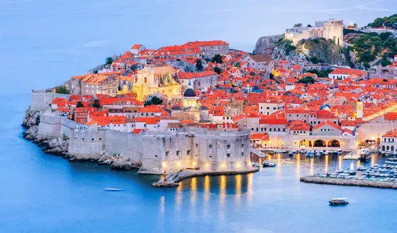 Dubrovnik old town walls and harbour at dusk