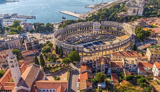 The Roman amphitheatre and harbour of Pula from above